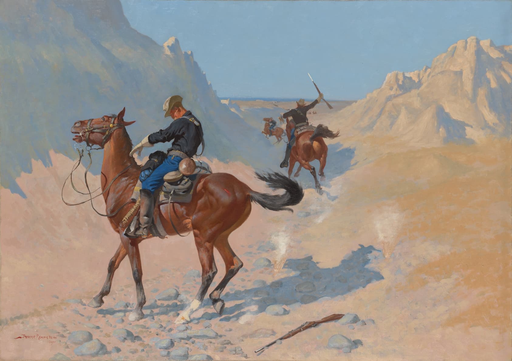 Three cavalry scouts—light-skinned men mounted on gleaming brown horses—among light-beige, arid mountains. The figure in the foreground has begun to to slump and seems poised to fall, his rifle on the ground, his horse agitated and alarmed. The others ride off in pursuit.